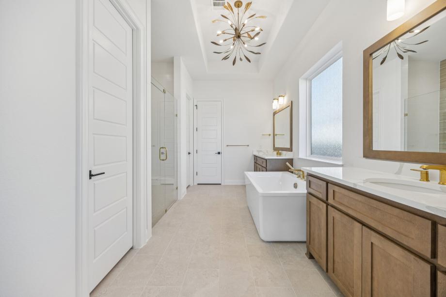 Luxurious primary bath with a large soaking tub