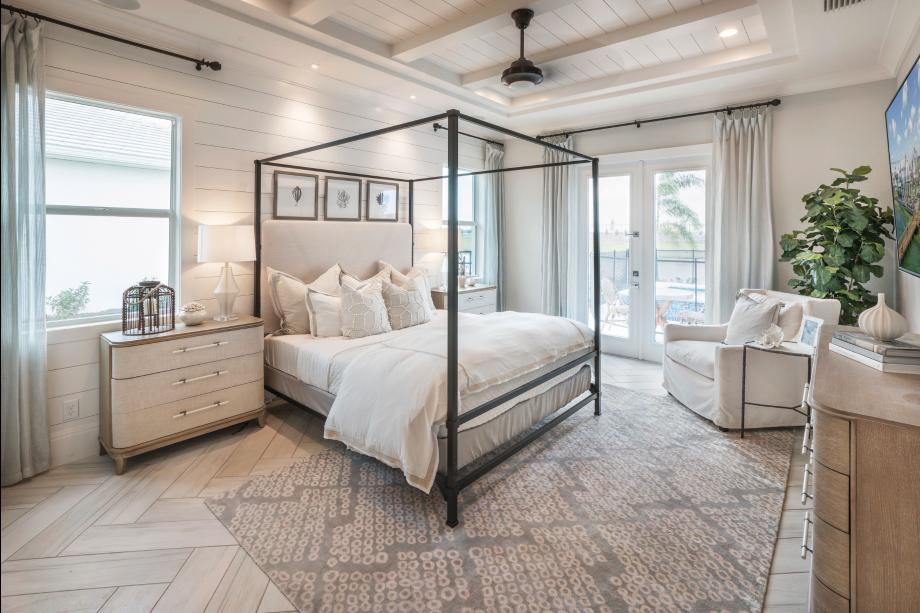 Expansive primary bedroom suite with access to rear lanai