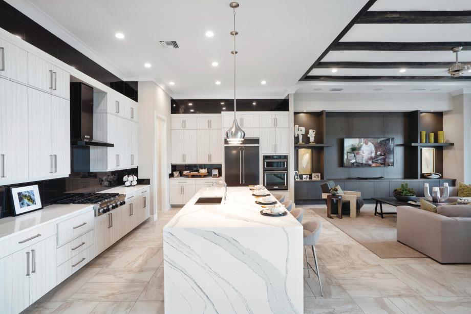 Gourmet kitchen with large center island connects to the open-concept great room