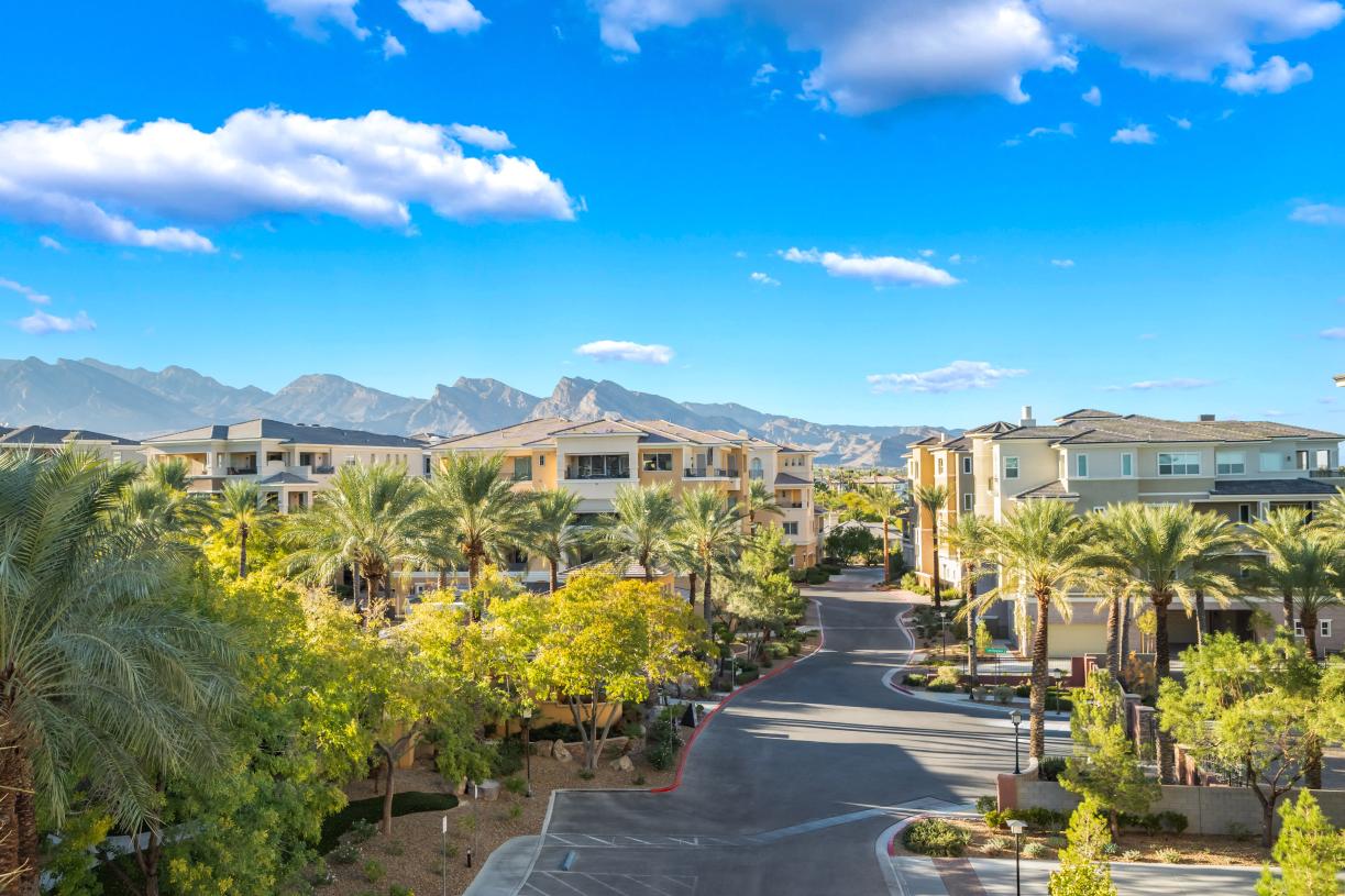 Luxury condo community set against a scenic backdrop