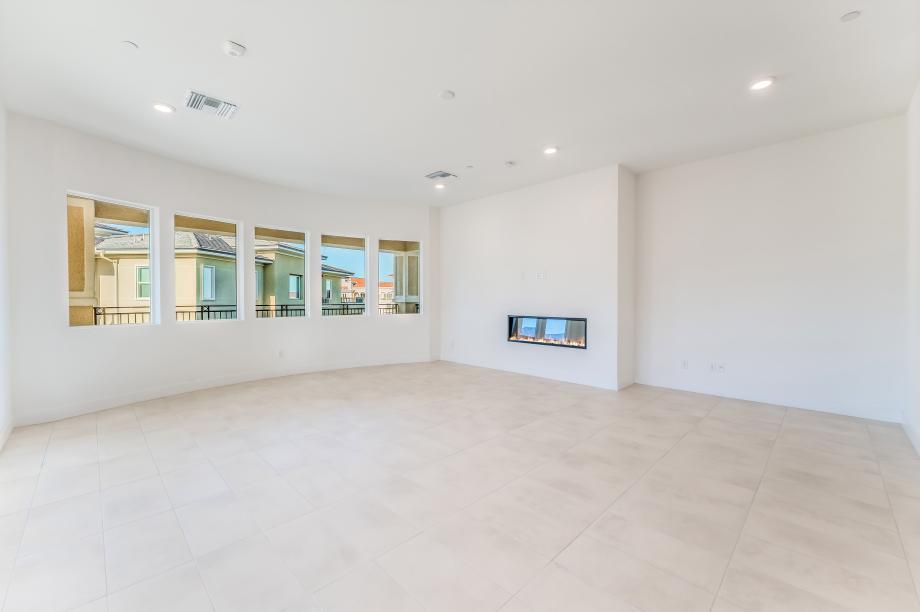 Lovely living room with abundant light and linear fireplace