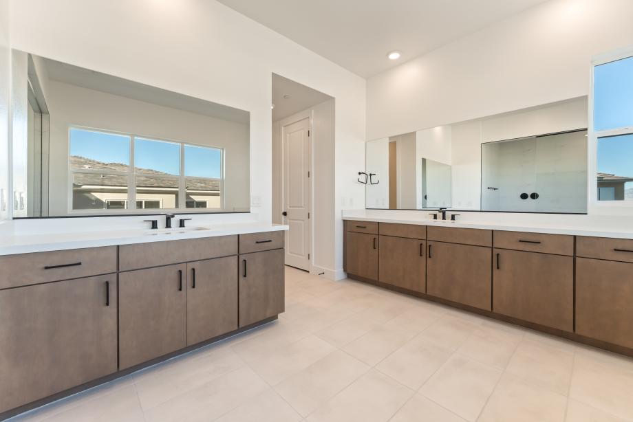 Separate dual vanities at primary bath