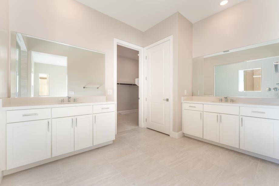 Separate dual vanities at primary bath
