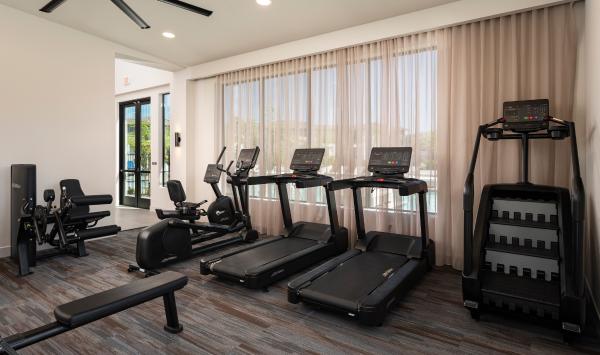 Fitness center with poolside views