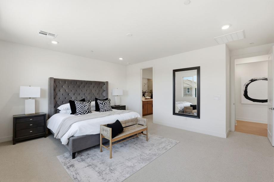 Primary bedroom suite with stunning fixtures and an abundance of natural light