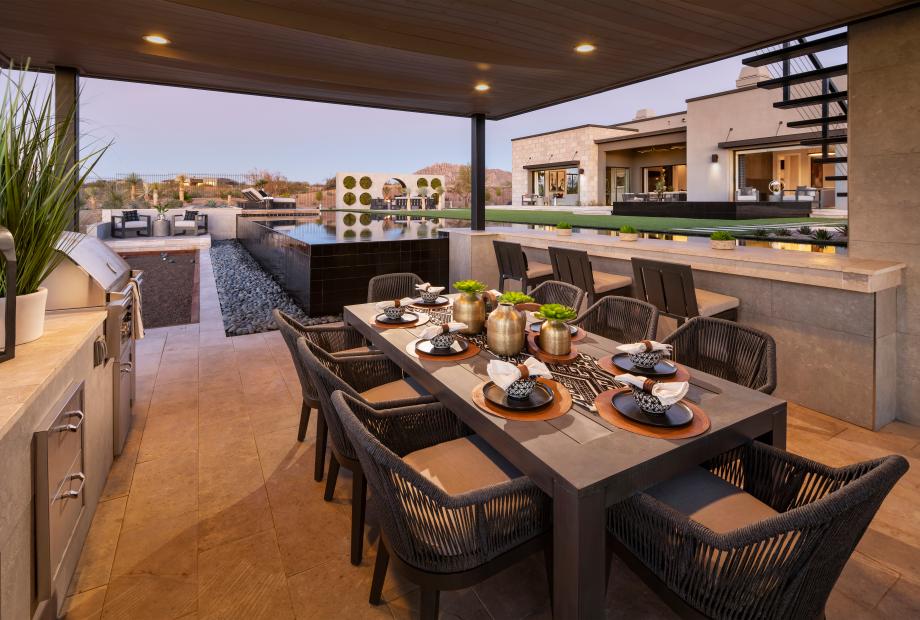 Resort-style backyard with pool, outdoor kitchen, bocce ball, and more