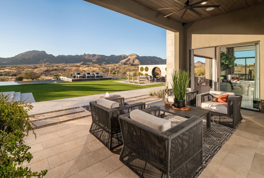 Oversized cover patio that overlooks the resort-style backyard