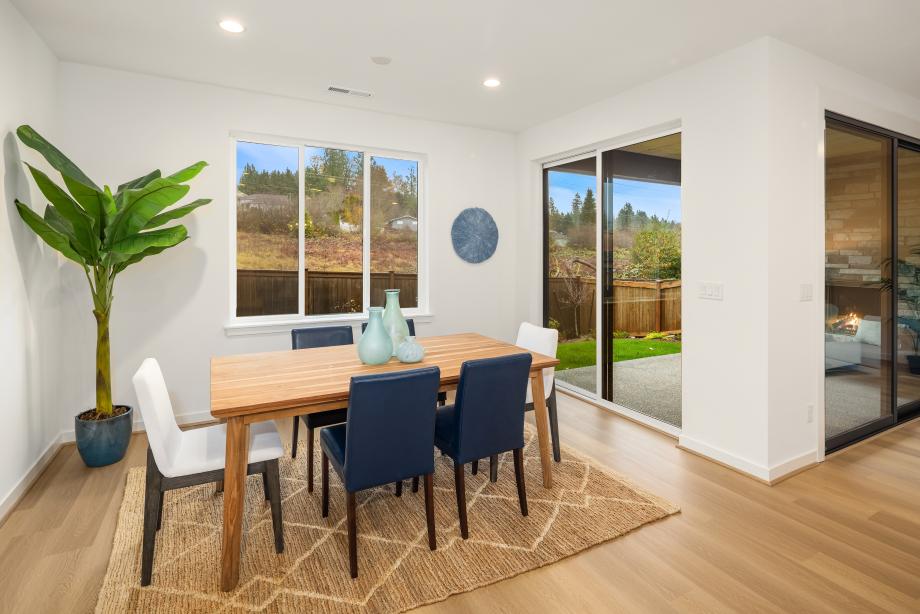 Sliding patio doors on two walls create seamless indoor-outdoor living