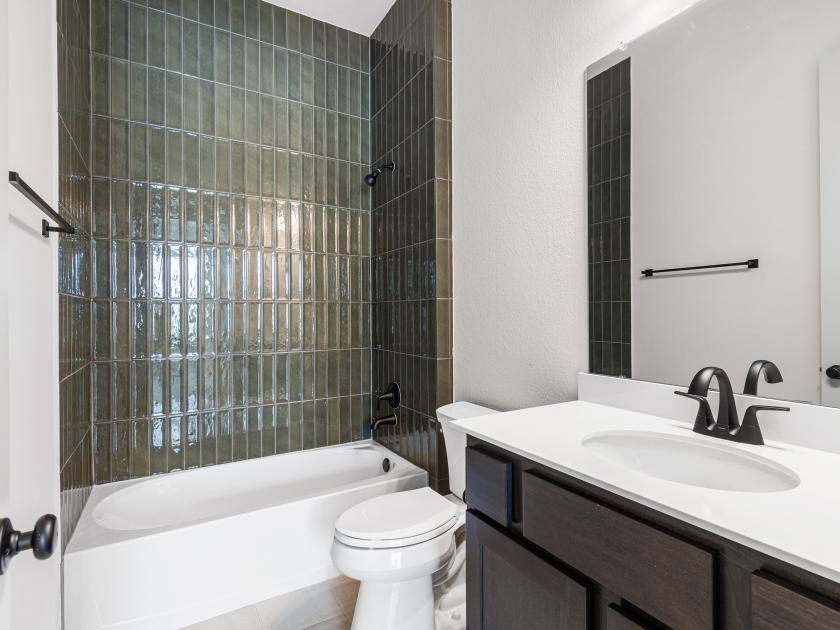 Secondary Bathroom with upgraded tile