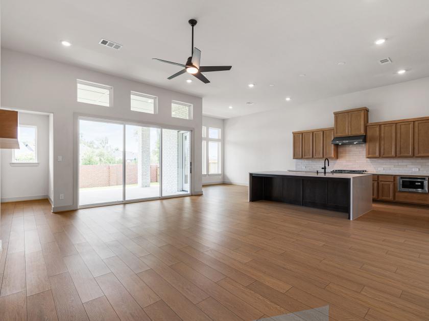 Great room with access to the kitchen and casual dining