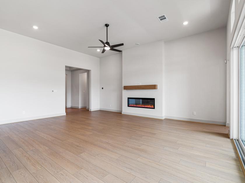Great room with fireplace and sliding glass doors to the back patio