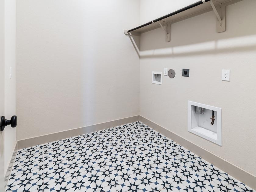 Laundry room with upgraded tile