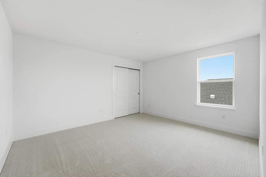 Bright, functional, and inviting secondary bedroom