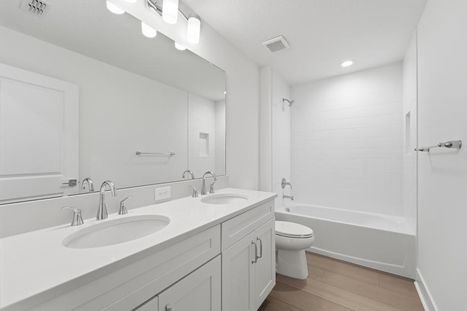 Fresh, clean, and effortlessly modern secondary bathroom