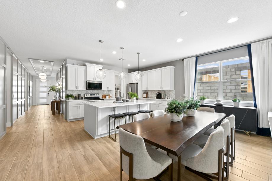 Gourmet kitchen boasting a large center island with quartz countertops