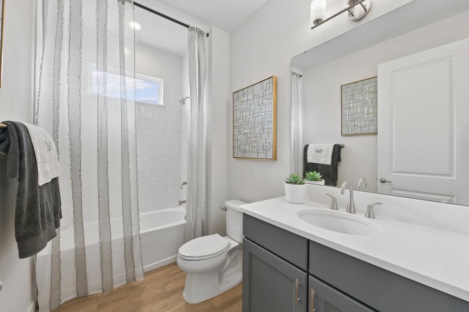A sleek, modern secondary bathroom