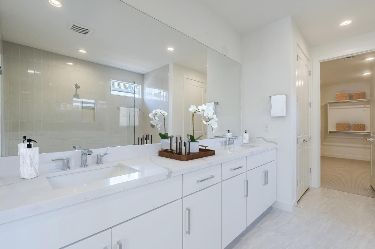 Primary bathroom with stunning glass shower and dual-sink vanity