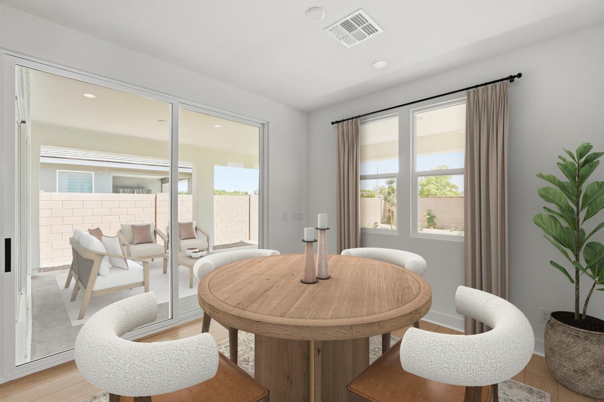 Casual dining area with ample natural lighting and direct back patio access
