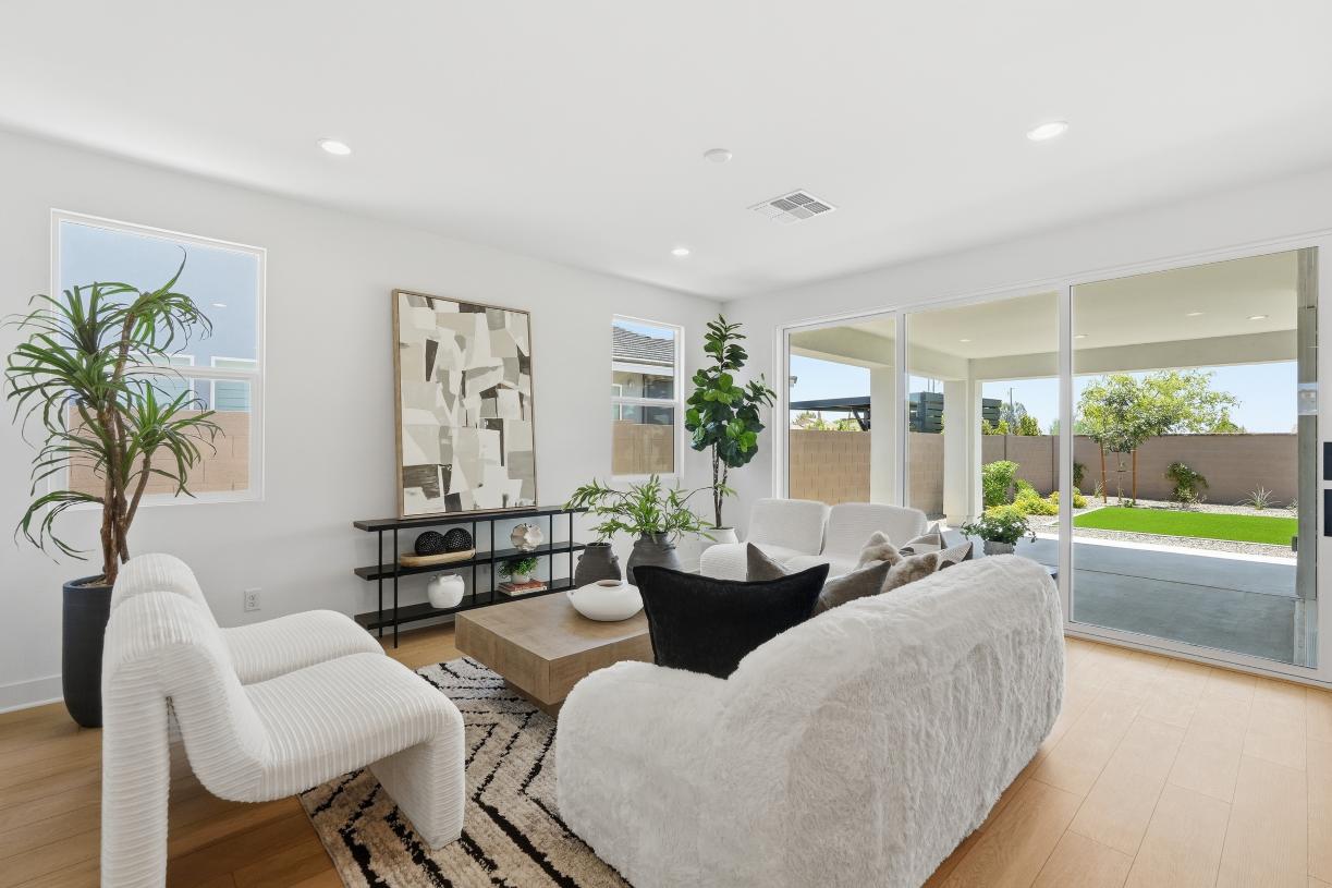 Spacious great room with sliding glass door leading to extended patio