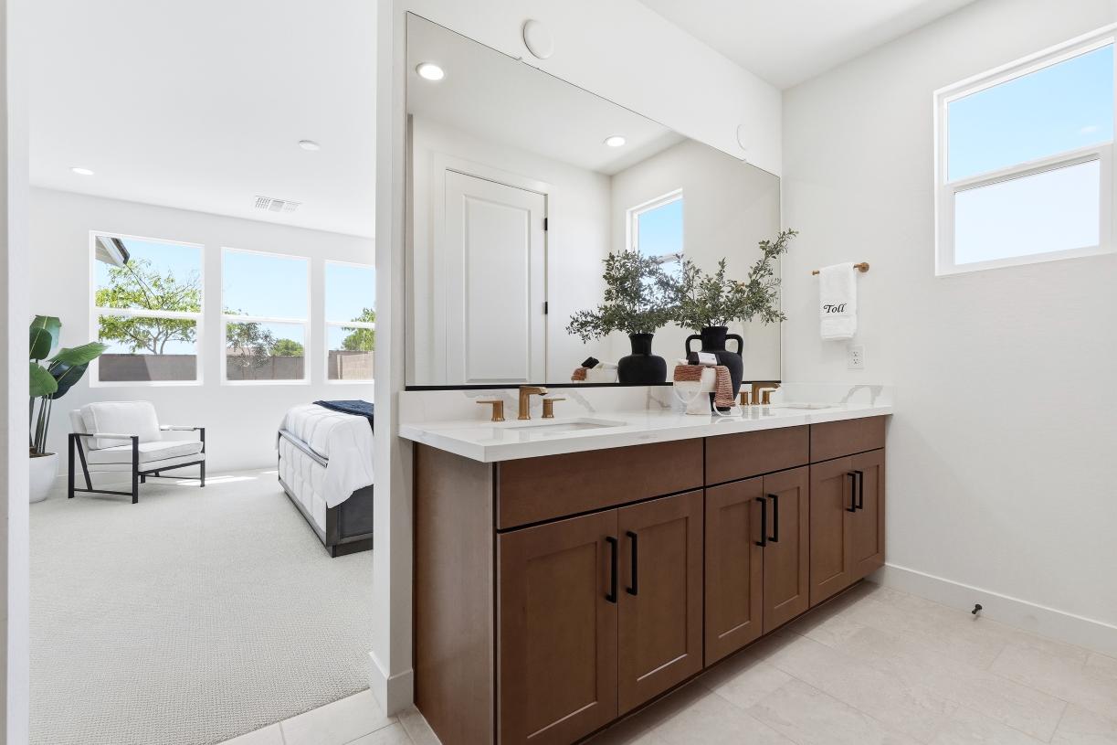 Primary bathroom with dual vanities and stunning accents