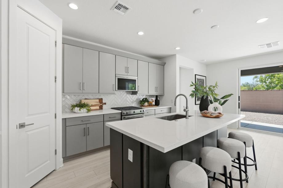 Beautiful kitchen with upgraded cabinets and direct patio access