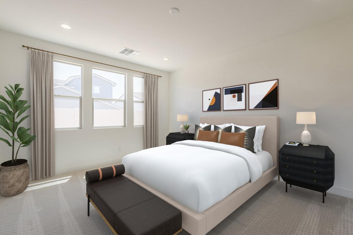 Primary bedroom suite with neutral finishes and an abundance of natural light