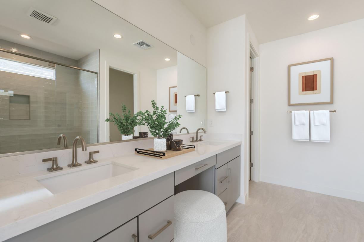 Primary bathroom with stunning glass shower and dual-sink vanity
