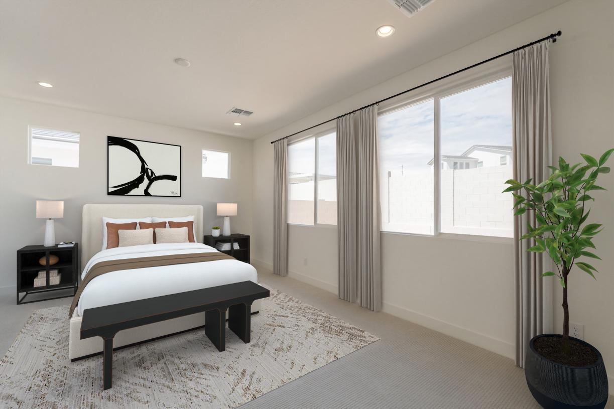 Primary bedroom suite with neutral finishes and ample natural lighting