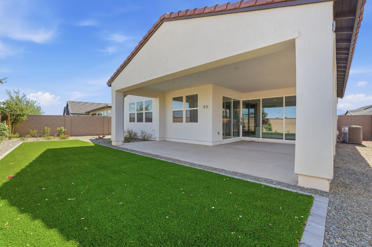 Extended covered patio perfect for entertaining or relaxation
