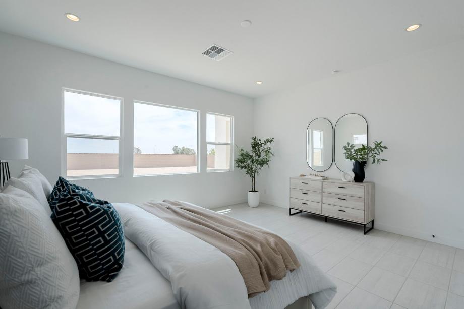 Beautiful primary bedroom suite with ample natural light