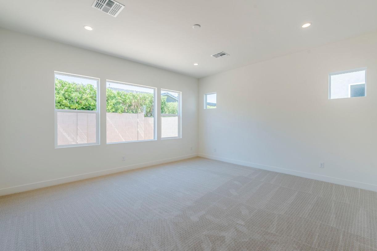Expansive primary bedroom with luxurious finishes