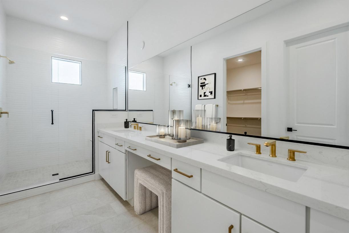 Primary bathroom with gorgeous glass shower and dual-sink vanity