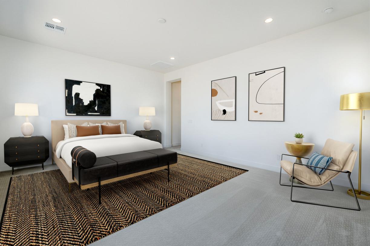 Stunning primary bedroom suite with ample natural lighting