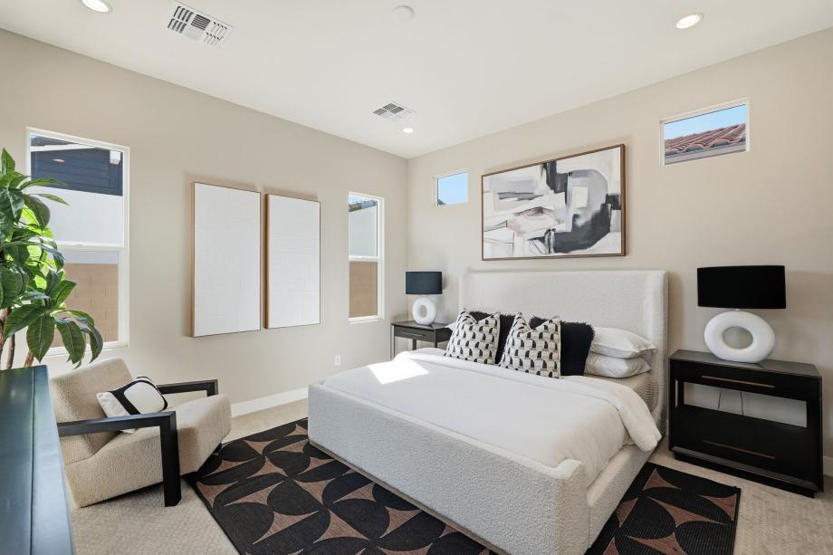 Primary bedroom suite with stunning fixtures and an abundance of natural light