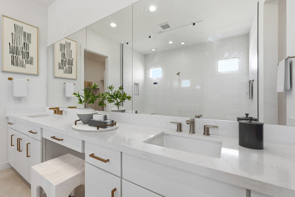 Gorgeous primary bathroom with dual-sink vanity and glass shower door