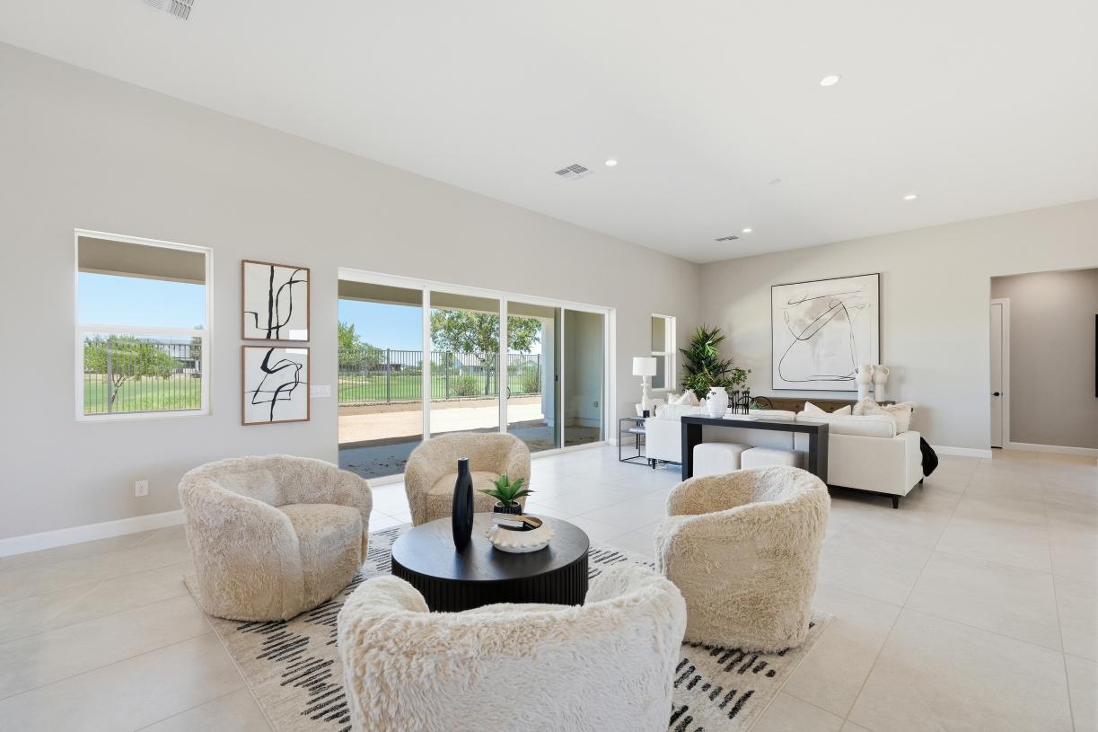 Spacious great room with sliding glass door leading to extended patio