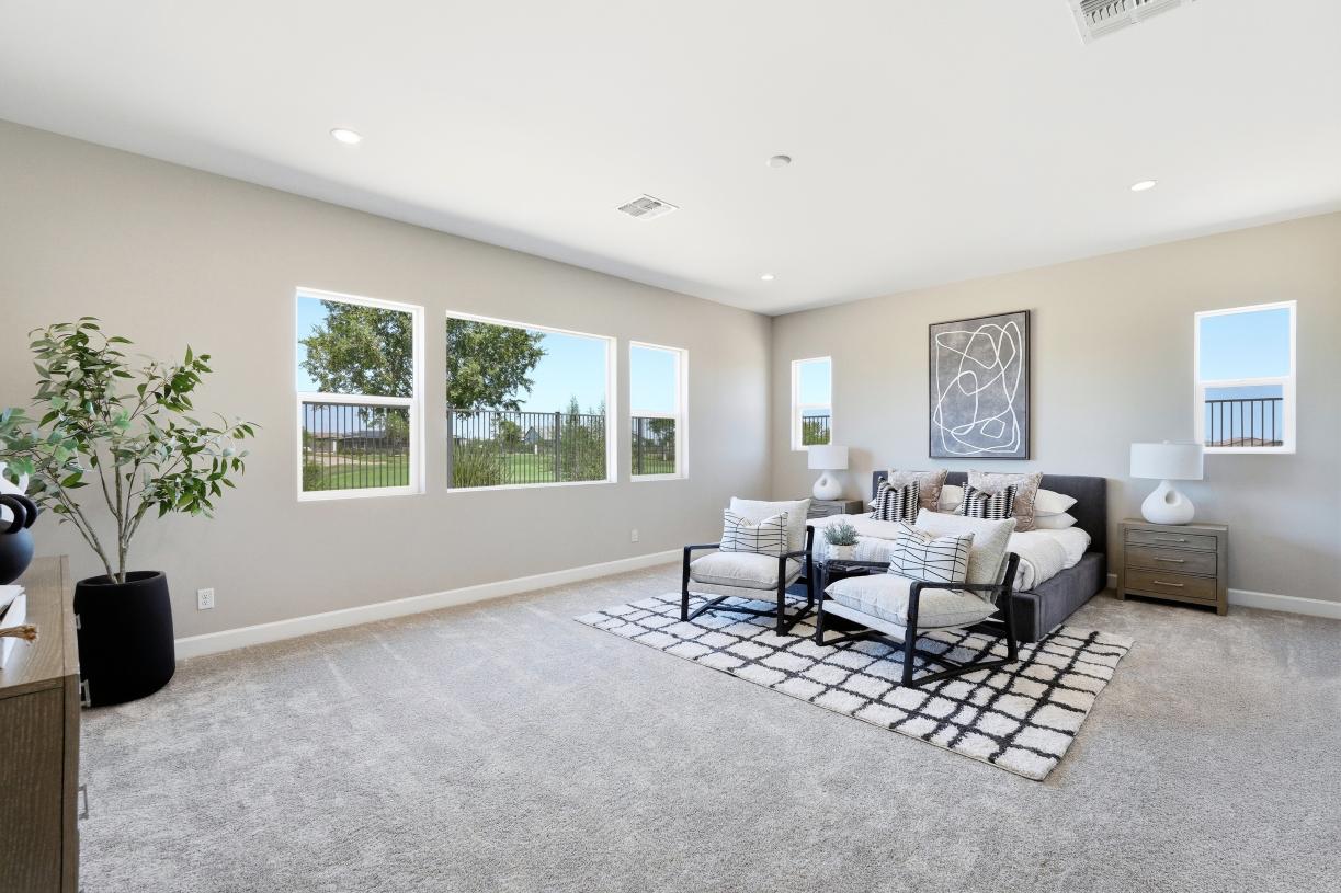 Serene primary bedroom suite with neutral finishes