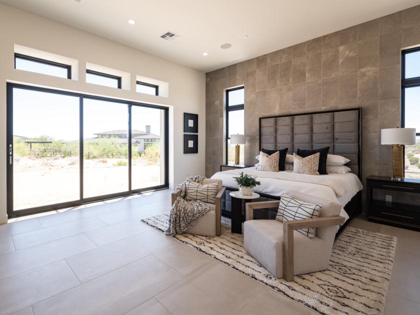 Serene primary bedroom suite with ample natural lighting