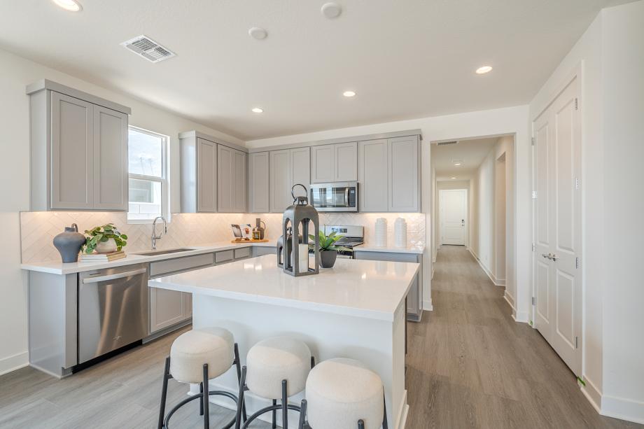 Well-appointed kitchen with beautiful cabinets and tile backsplash