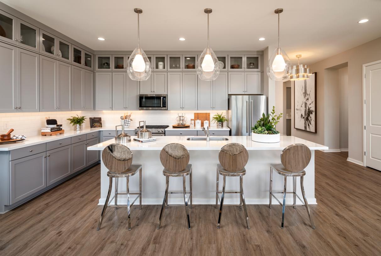 Stunning kitchens with ample cabinet space, and large center island for casual dining