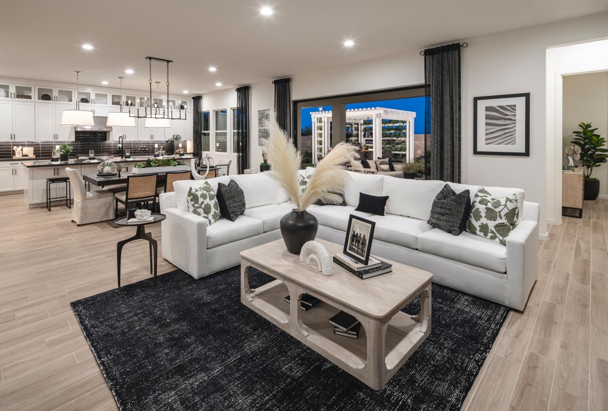 Open-concept floor plan with views of the great room, multi-sliding glass doors, and backyard