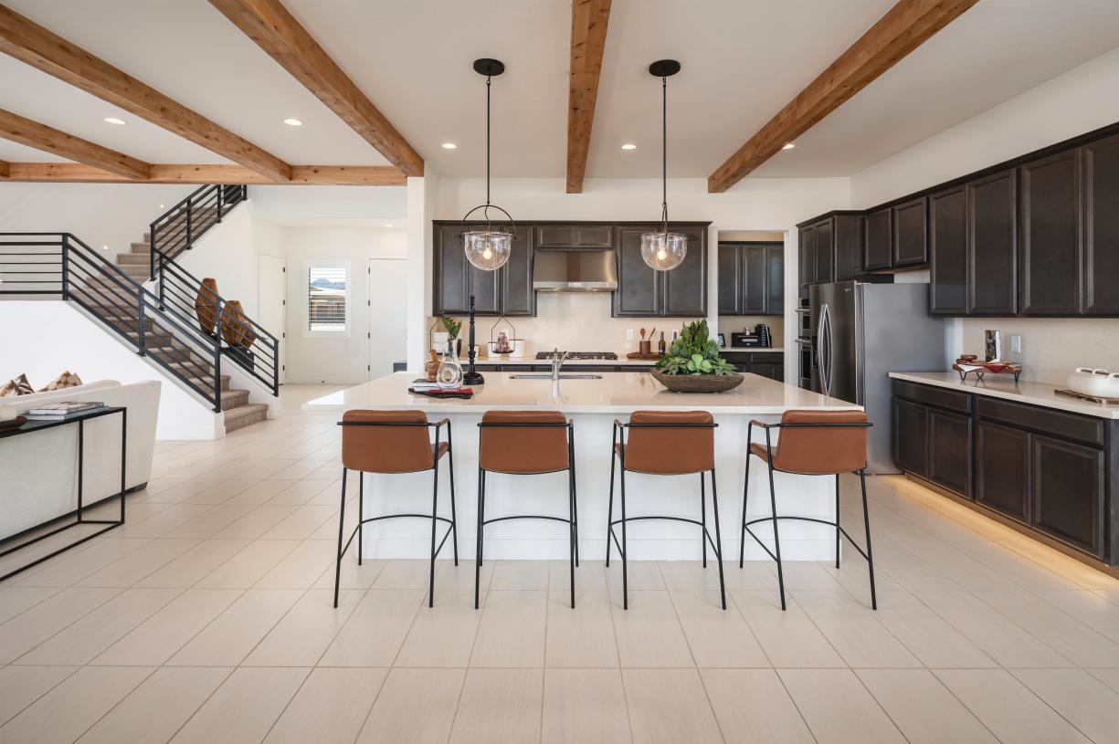 Well-equipped kitchens with ample countertop and cabinet space with large center islands for casual dining