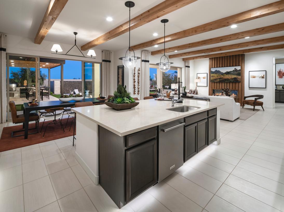 Open-concept floor plan with views of the casual dining area, great room, and backyard