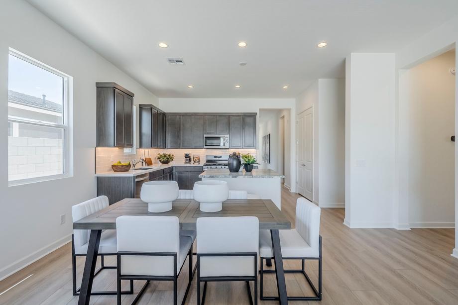 Casual dining area with ample natural lighting and direct kitchen access