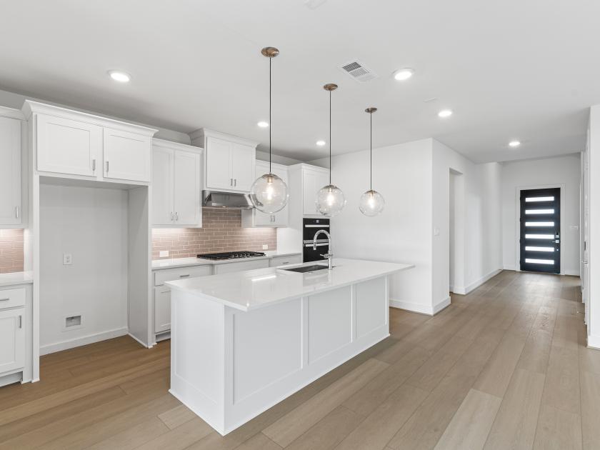 Well-equipped kitchen with beautiful cabinets and ample countertop space