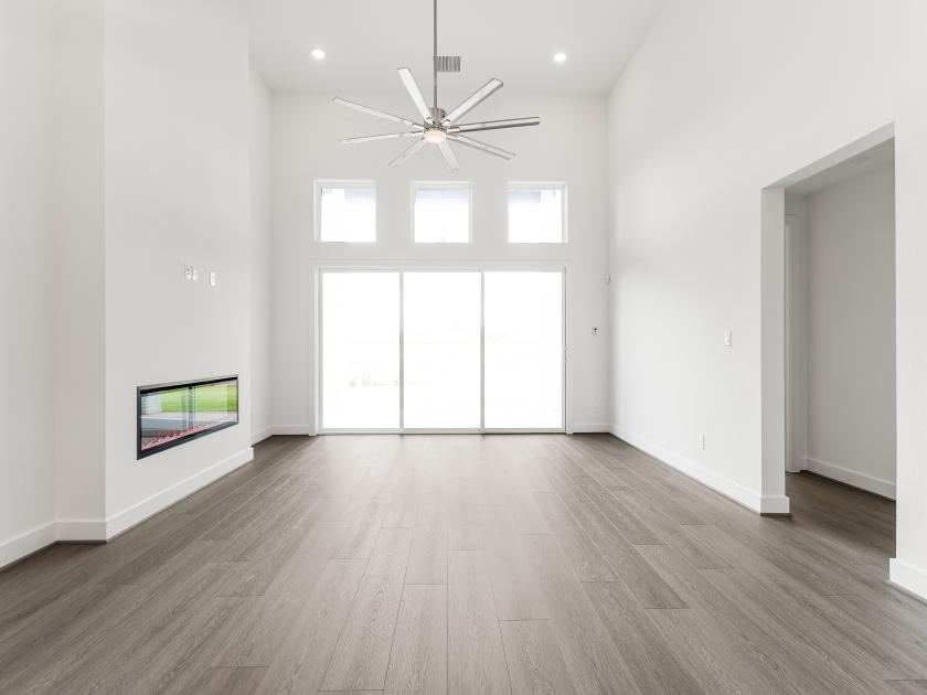 Great room with tall ceilings and a cozy fireplace