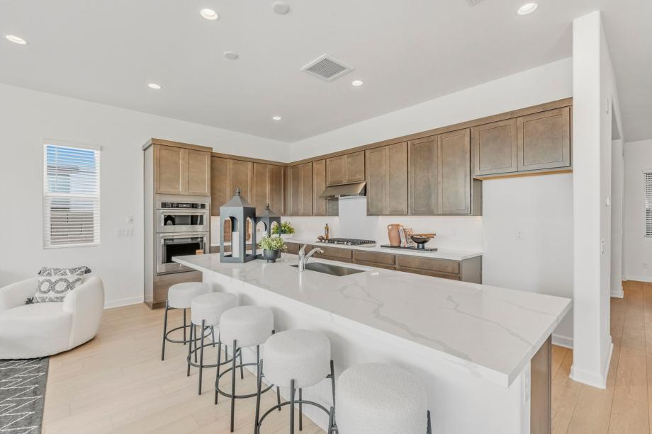 Spacious great room with ample natural light and neutral finishes