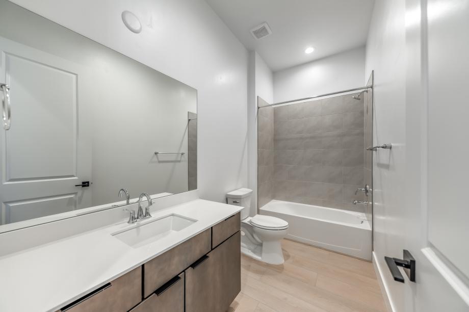 Secondary bathroom with beautiful shower surround
