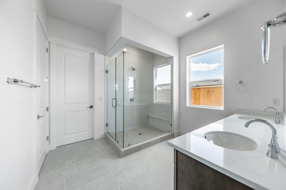Primary bathroom with huge walk-in shower and walk-in closet