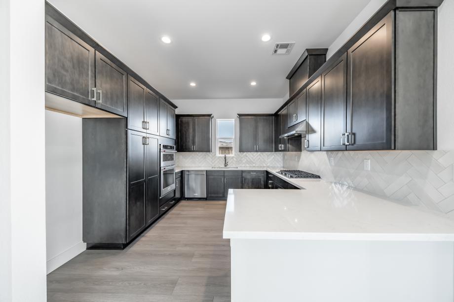 Beautiful kitchen with stainless steel appliances, and ample countertop and cabinet space